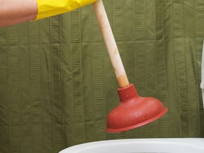 plunging a toilet