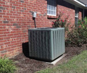 High-efficiency HVAC unit outside a home - Mac 5 Services High-efficiency HVAC unit outside a home