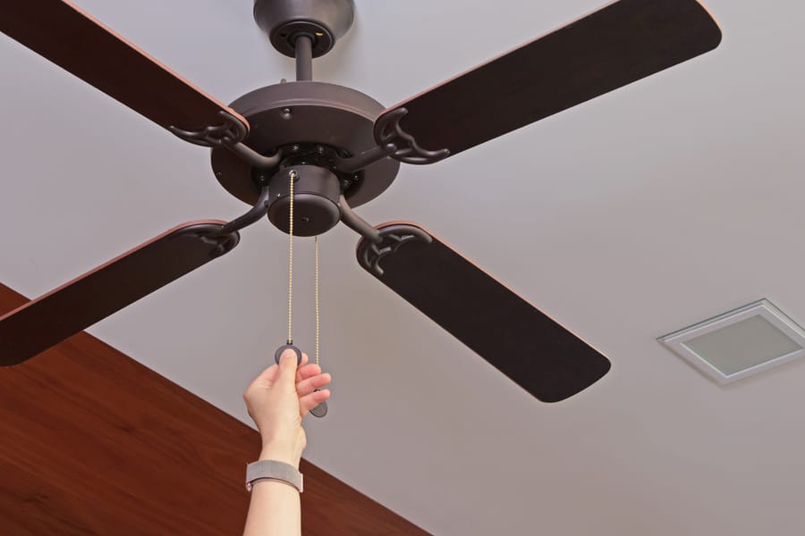 Ceiling fan being turned on.