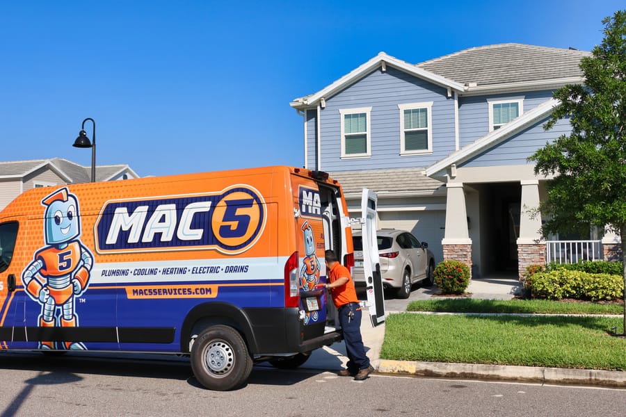 A Mac 5 van outside home preparing for gas leak check.