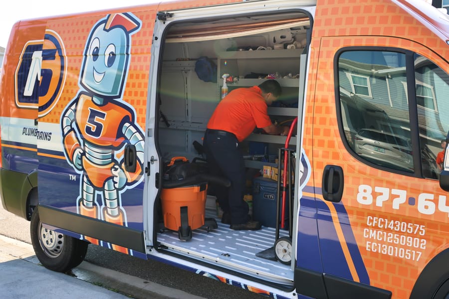 Mac 5 plumber in truck preparing for an appointment.