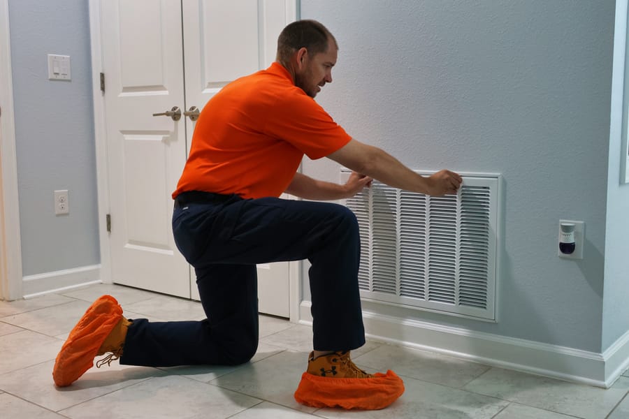 Mac 5 technicians removing air vent.